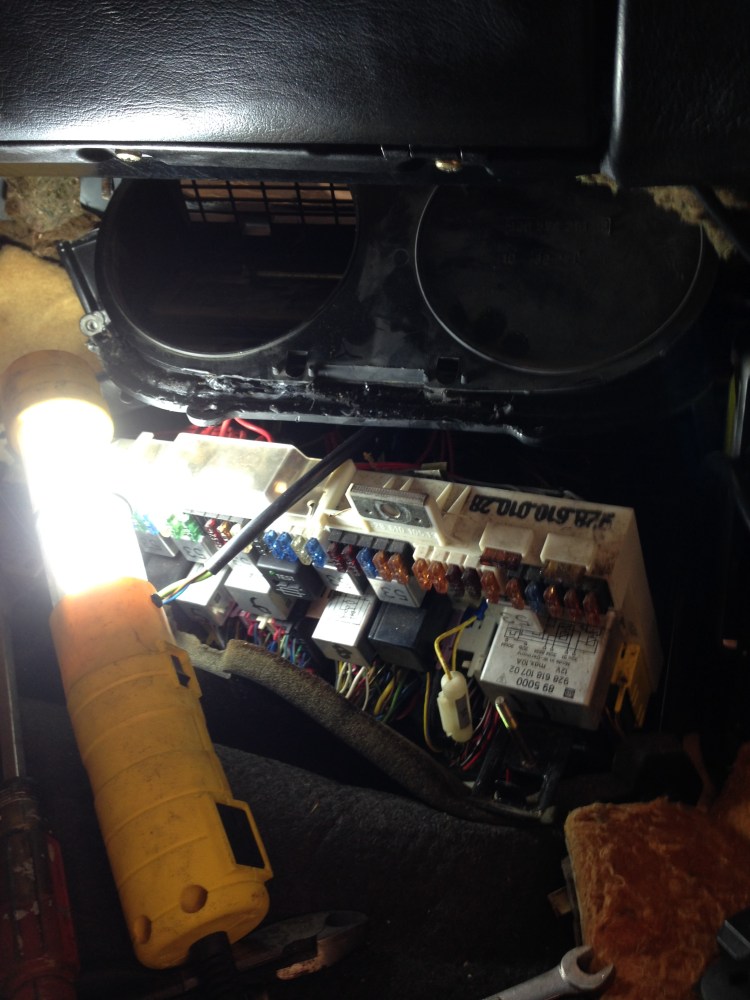 View of the Fuse Panel.  The recirc flap assembly is partially lowered from it's home above the fuse panel.